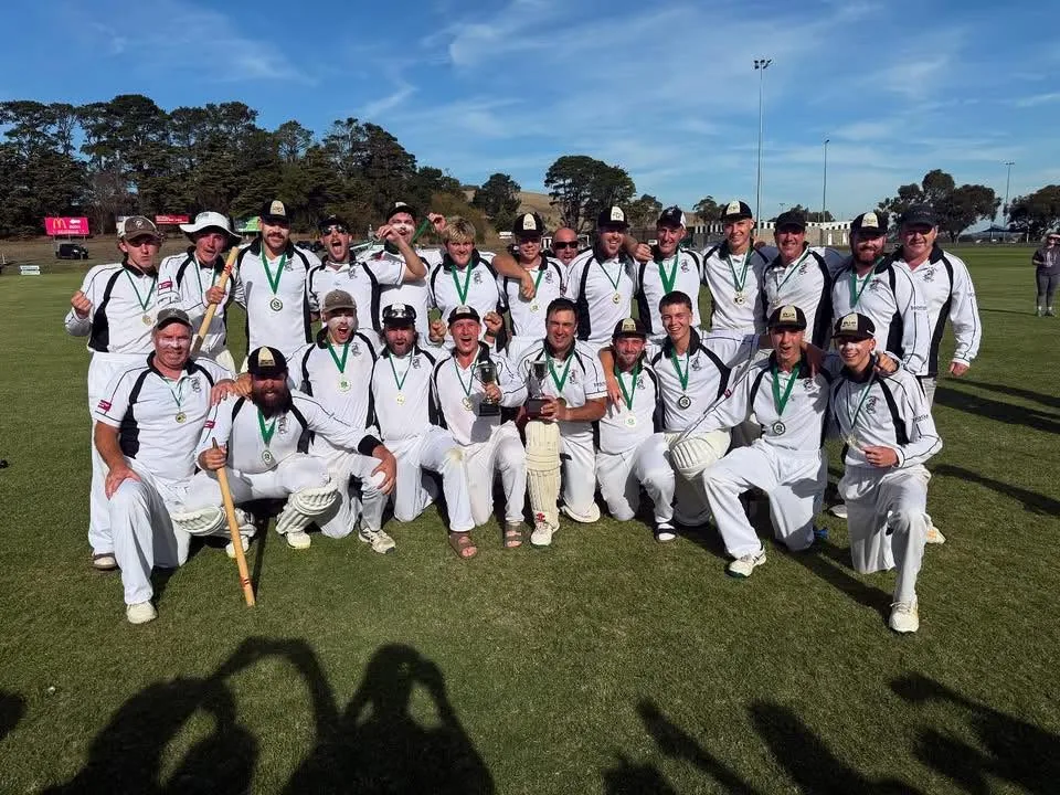 Wallan District Cricket Club players in their whites with medals